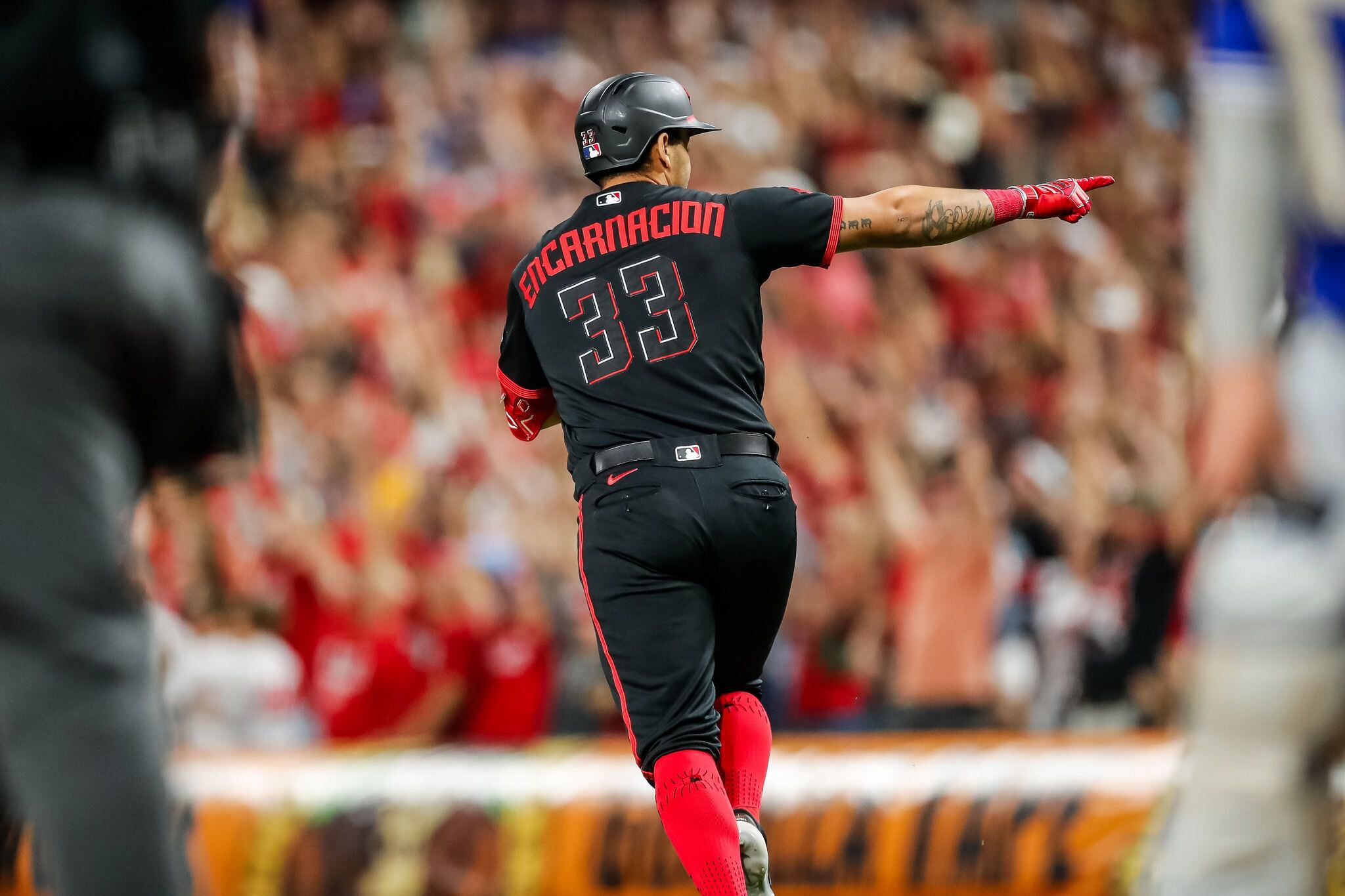 Cincinnati Reds' Christian Encarnacion-Strand (33) bats during a