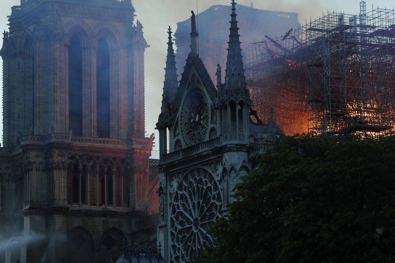 New golden rooster weathervane installed atop Notre Dame Cathedral spire -  CBS News